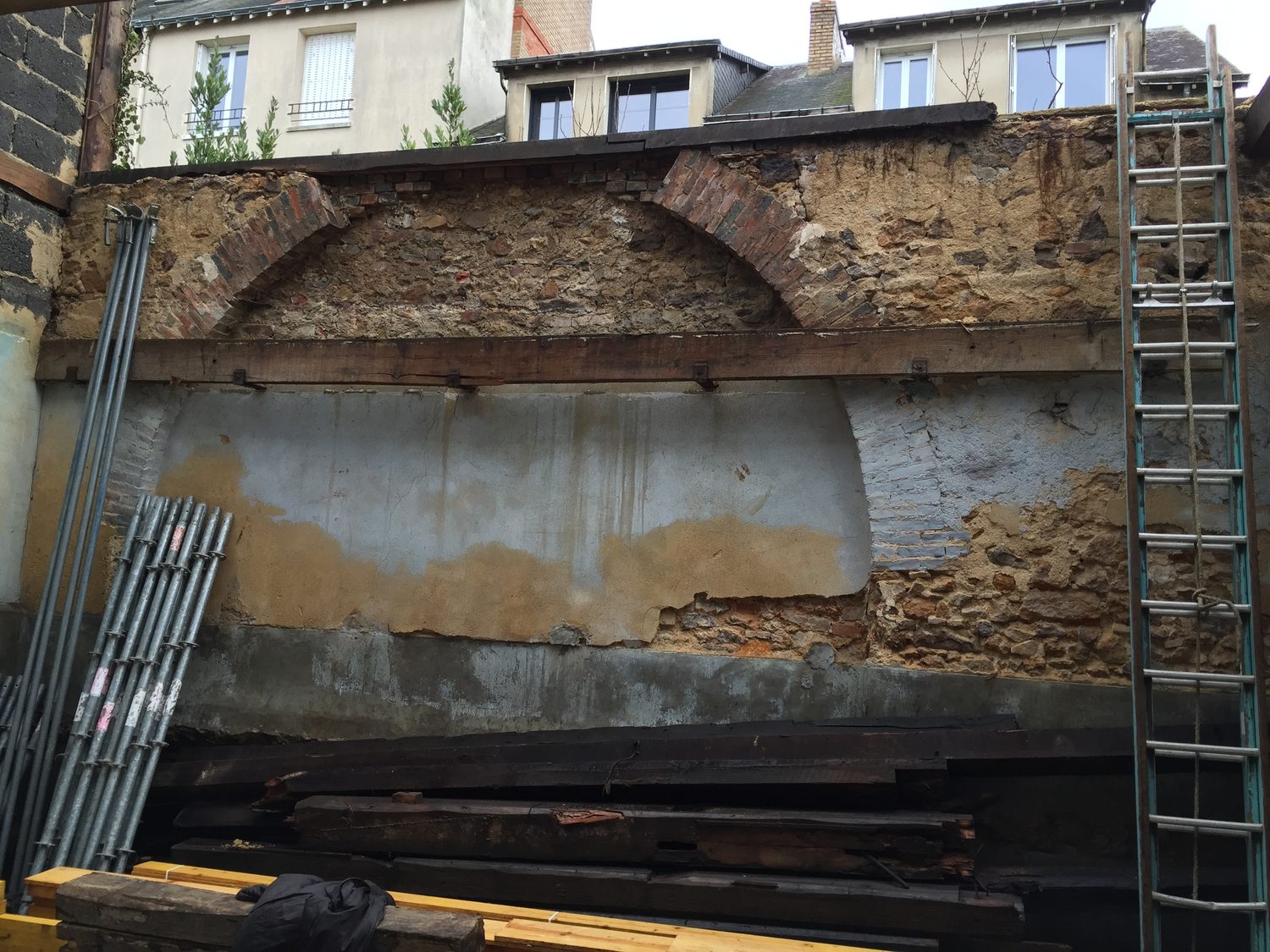Raw exterior courtyard before transformation