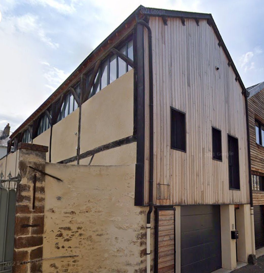 Renovated building envelope with timber cladding, Le Mans France
